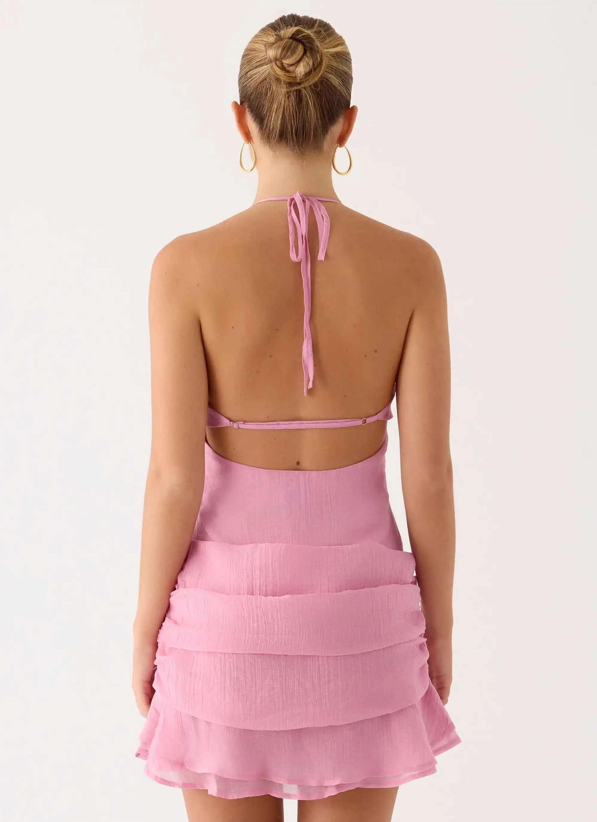 Pink backless short women's party dress by Corporación Turística, sleeveless, fitted style, perfect for special occasions.