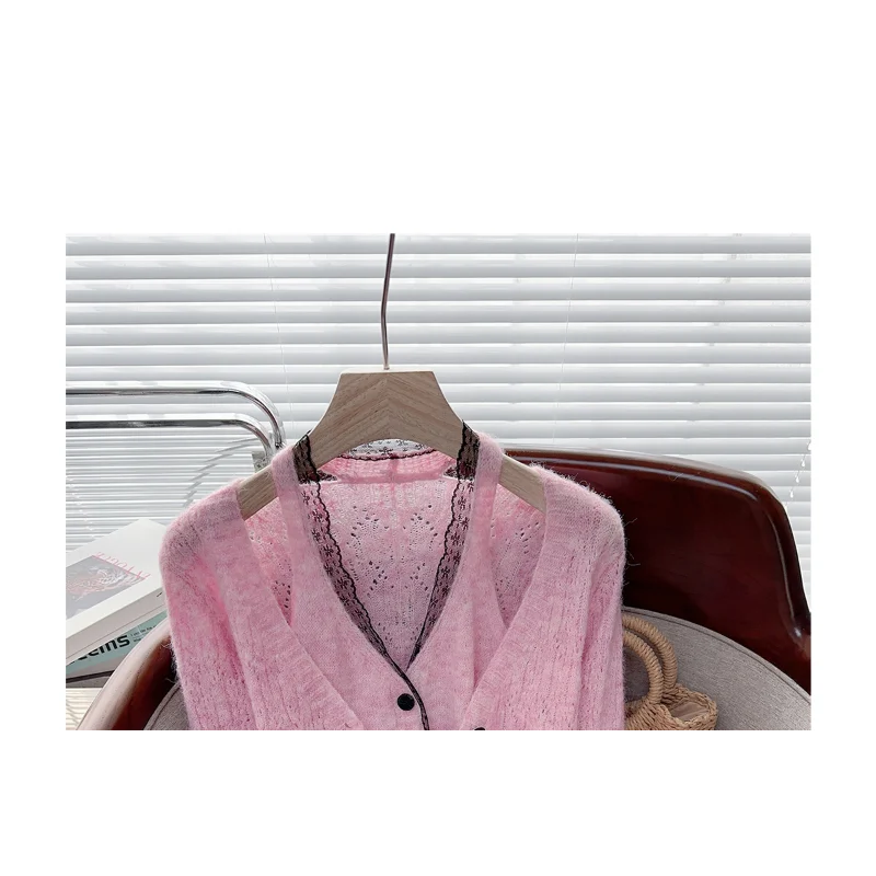 Pink button-up cardigan and faux two-piece sweater set from Corporación Turística, featuring a stylish top and cozy layered look.