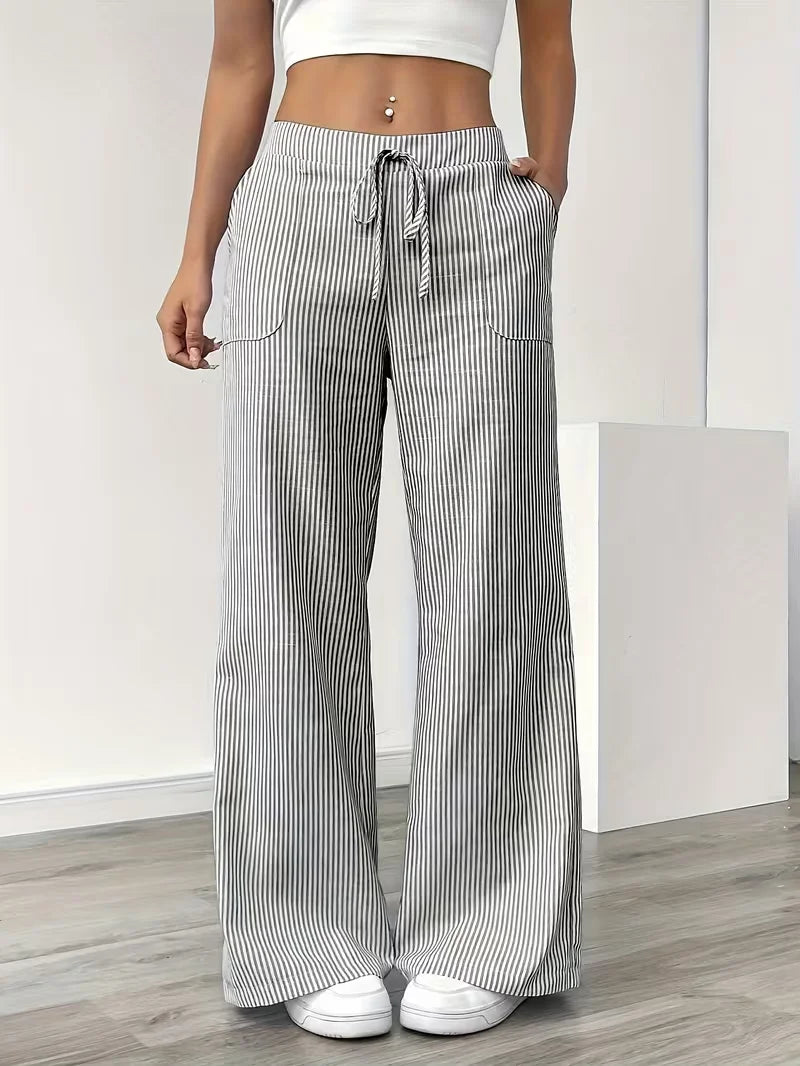 Set of three women's sports pants in pink from Corporación Turística, displayed laid out with elastic waistbands and sporty fit.