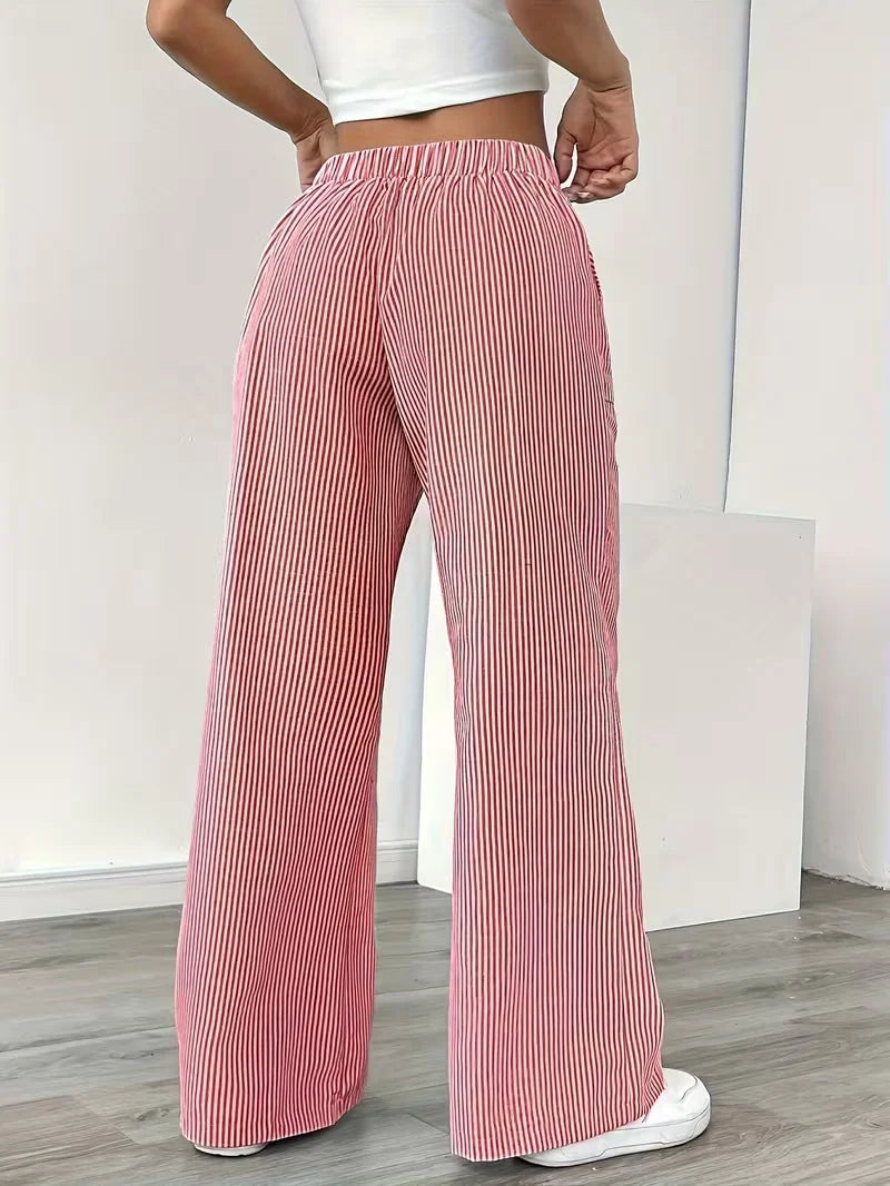 Three-piece women's sports pants set by Corporación Turística in pink, featuring elastic waistbands and sporty design.