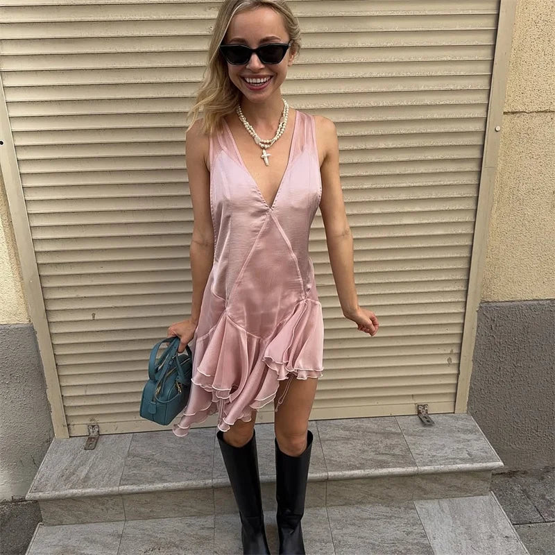 Pink sleeveless V-neck dress for women by Corporación Turística, featuring a deep V-neckline and fitted silhouette.