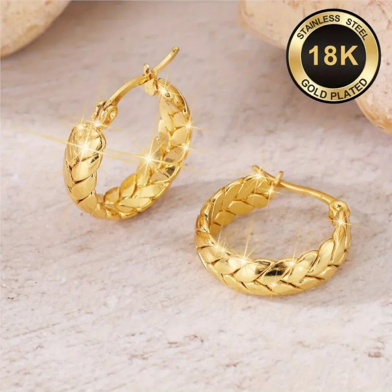 Silver 16mm stainless steel gold-plated hoop earrings from Corporación Turística, showcasing shiny, polished circular jewelry.