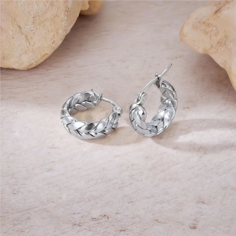 Silver 16mm stainless steel hoop earrings with gold plating, featuring a sleek circular design and shiny finish.