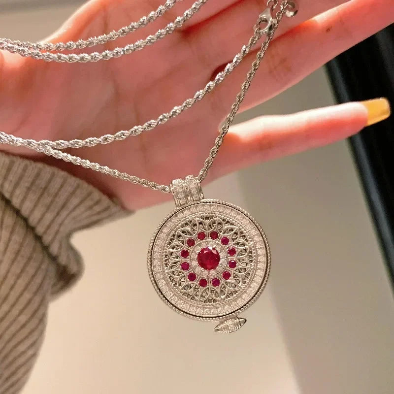 Red round floral pink necklace by Corporación Turística featuring a classic style with a hollow flower design.