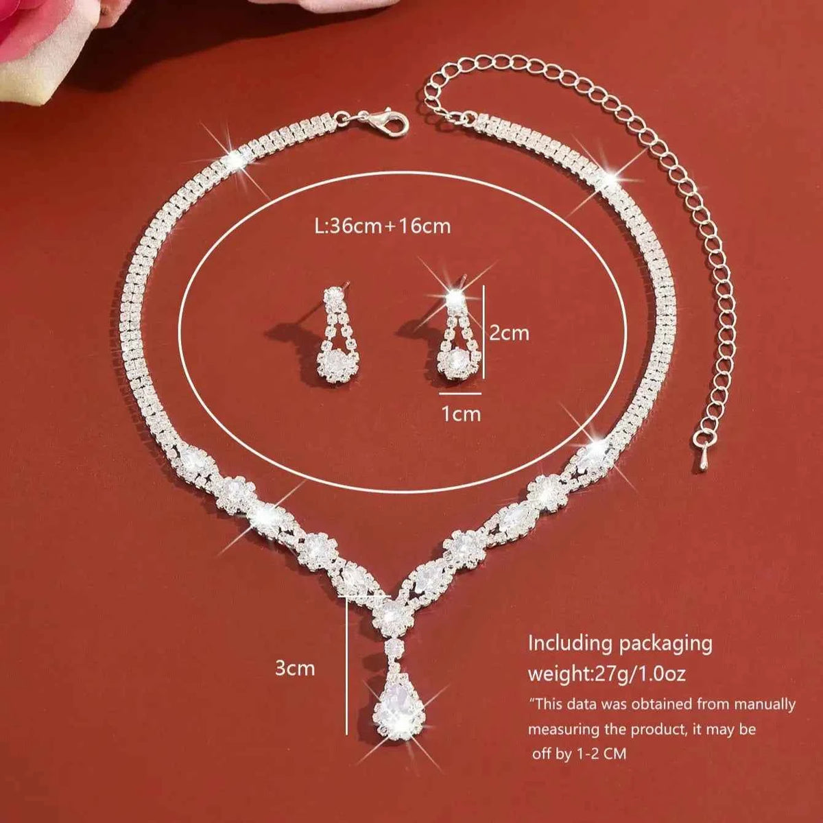 Luxury silver crystal jewelry set featuring elegant shaped pieces, crafted by Corporación Turística.