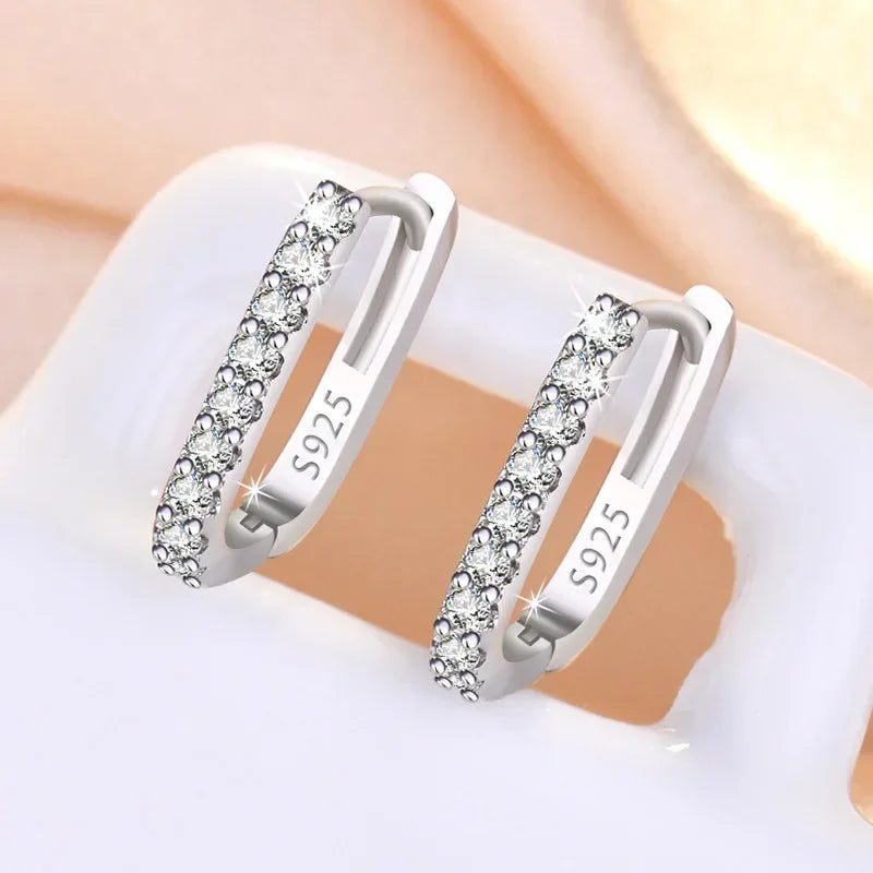 Sterling silver 925 circular hoop earrings from Corporación Turística, featuring sleek, shiny round design for elegant style.