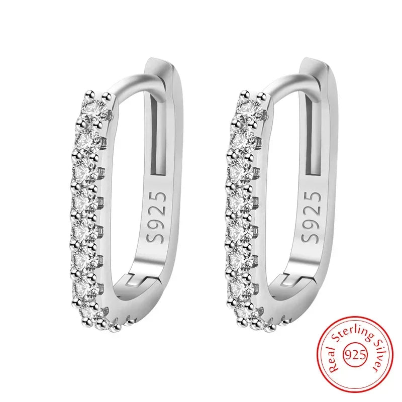 Silver 925 circular hoop earrings with decorative design, crafted by Corporación Turística, showcased on a white background.