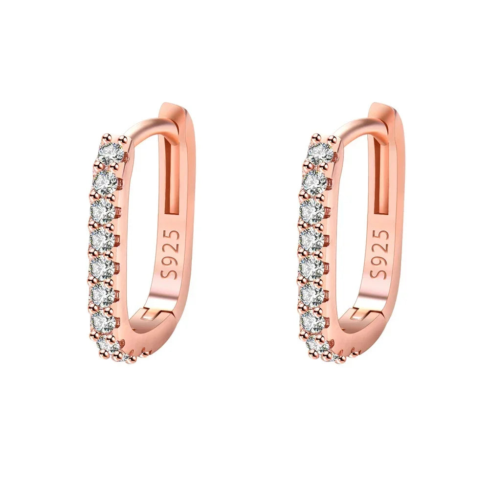 Sterling silver 925 circular hoop earrings with intricate design, crafted by Corporación Turística.