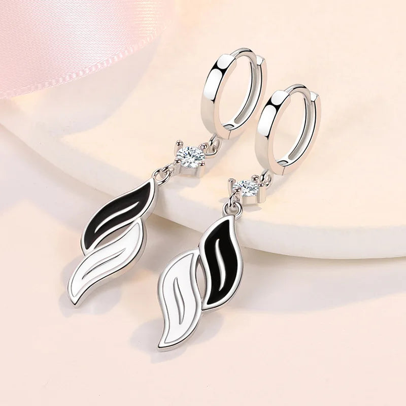 Silver KOFSAC earrings for women, made of 925 sterling silver, featuring elegant hanging design and polished finish.