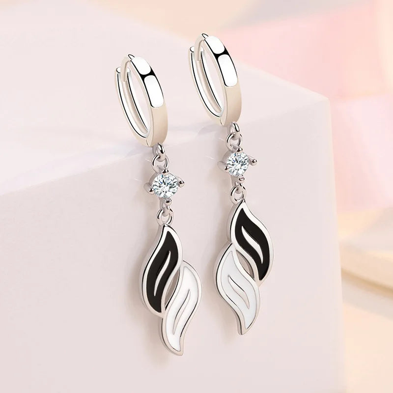 Silver KOFSAC earrings for women, crafted in 925 sterling silver, featuring elegant dangling design.