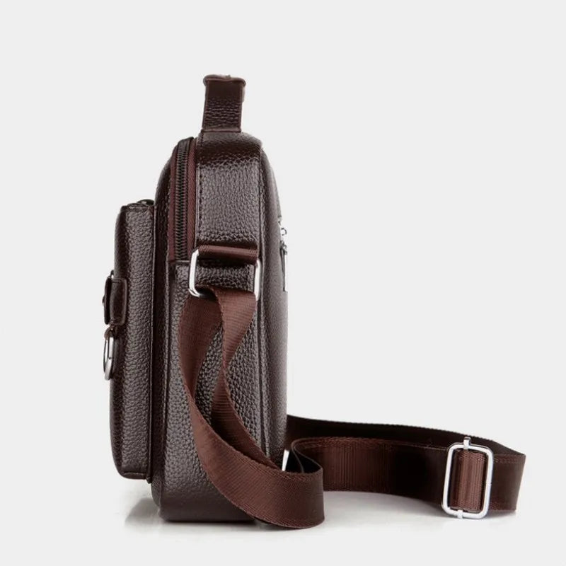 Men's shoulder bag by Corporación Turística, small PU leather crossbody bag with adjustable strap and sleek design.