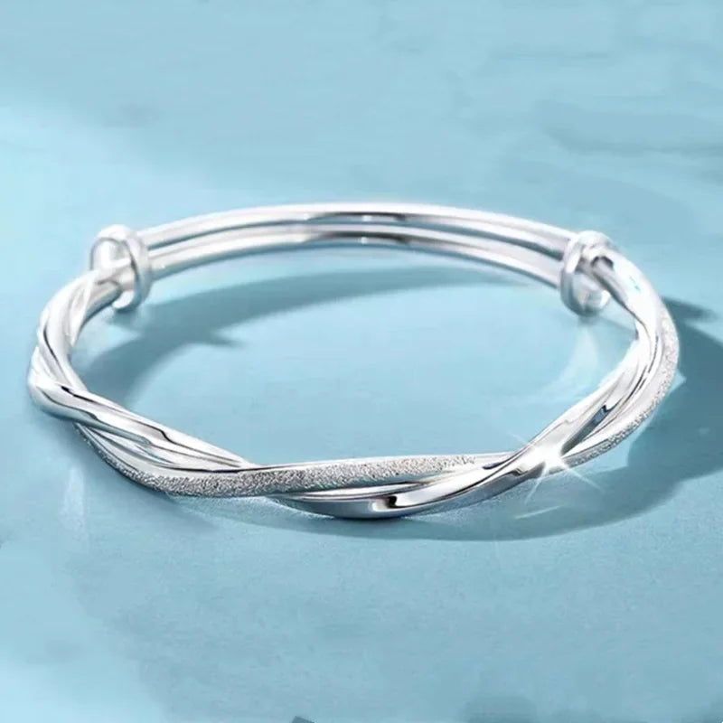 Sterling silver 925 bracelet with open display, featuring a sleek, polished design and secure clasp, by Corporación Turística.