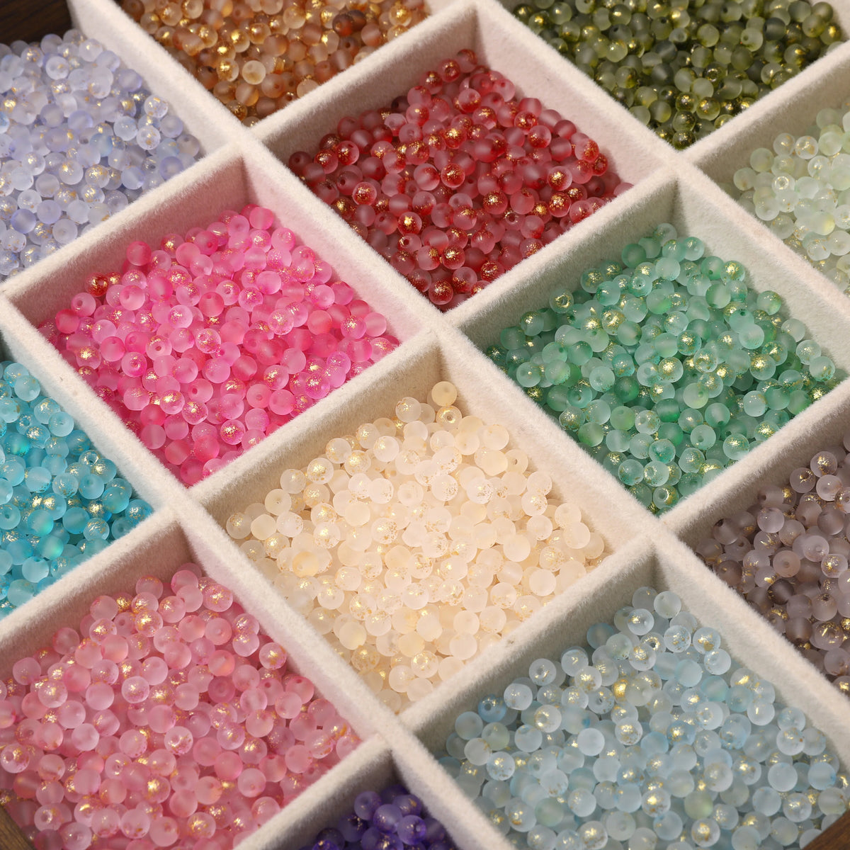 Set of 100 gold-splashed glass rice beads from Corporación Turística, 4mm small round jewelry-making beads.