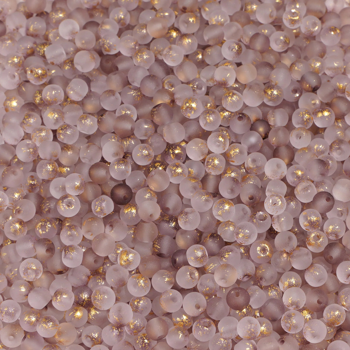 Set of 100 gold-splashed glass rice beads by Corporación Turística, 4mm round and glossy for jewelry making or crafts.