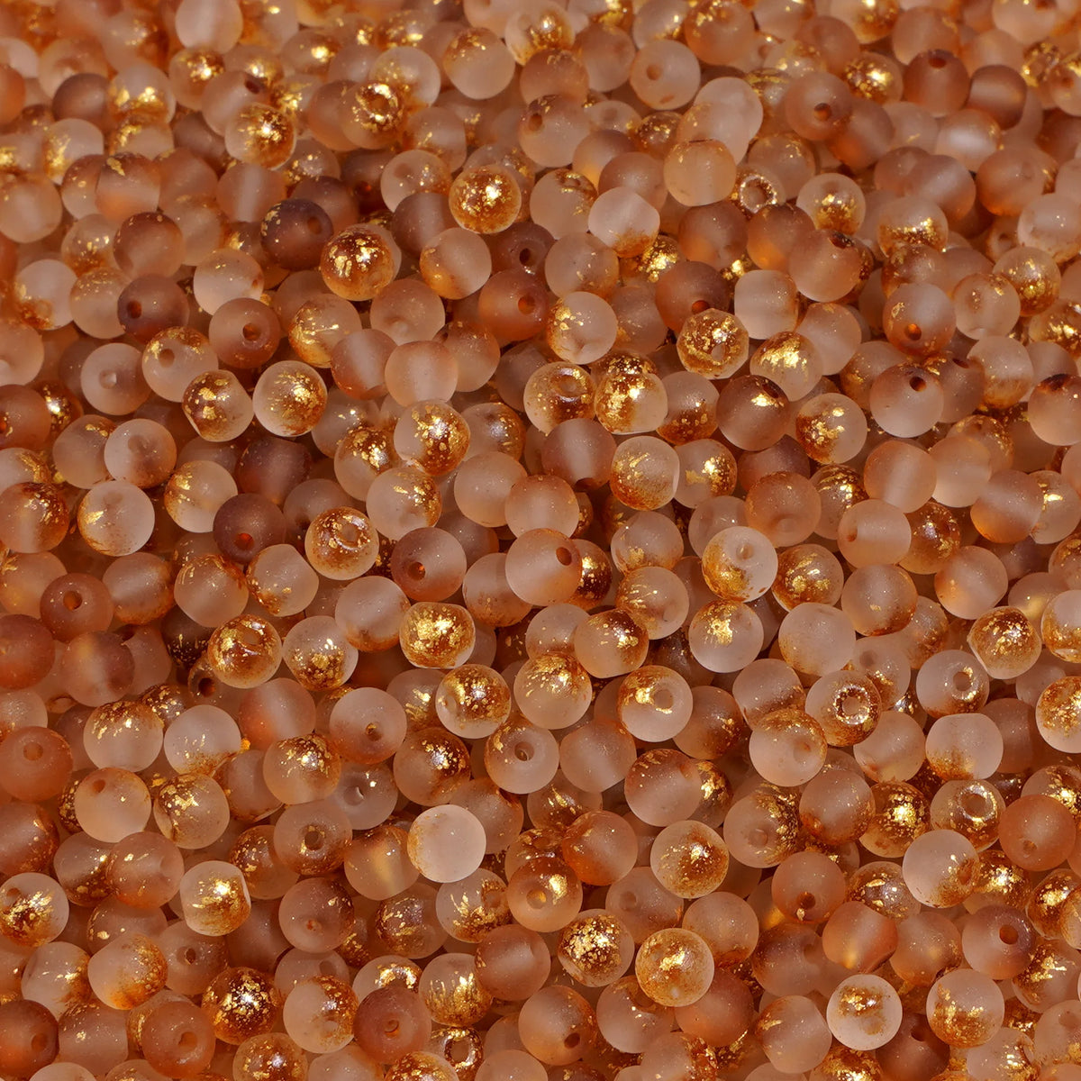 Set of 100 gold-splashed glass rice beads by Corporación Turística, 4mm, colorful and shiny for jewelry making and crafts.