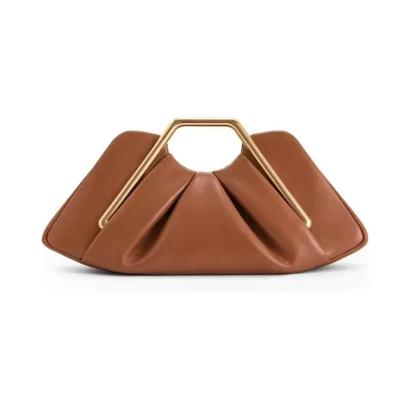 Soft black leather women's handbag by Corporación Turística with cloud-shaped design and textured finish.