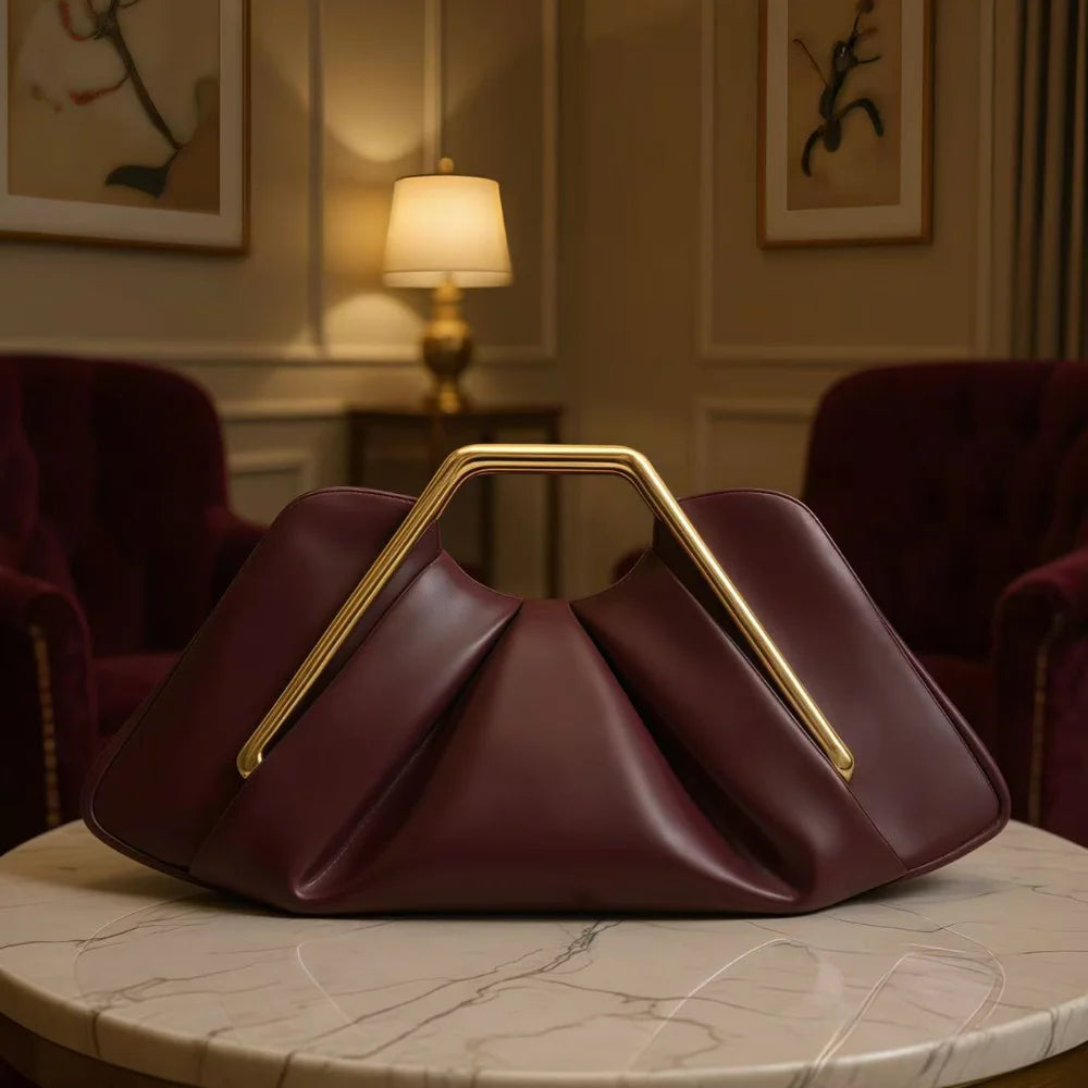 Soft black leather women's shoulder bag by Corporación Turística with cloud-inspired design and textured finish.