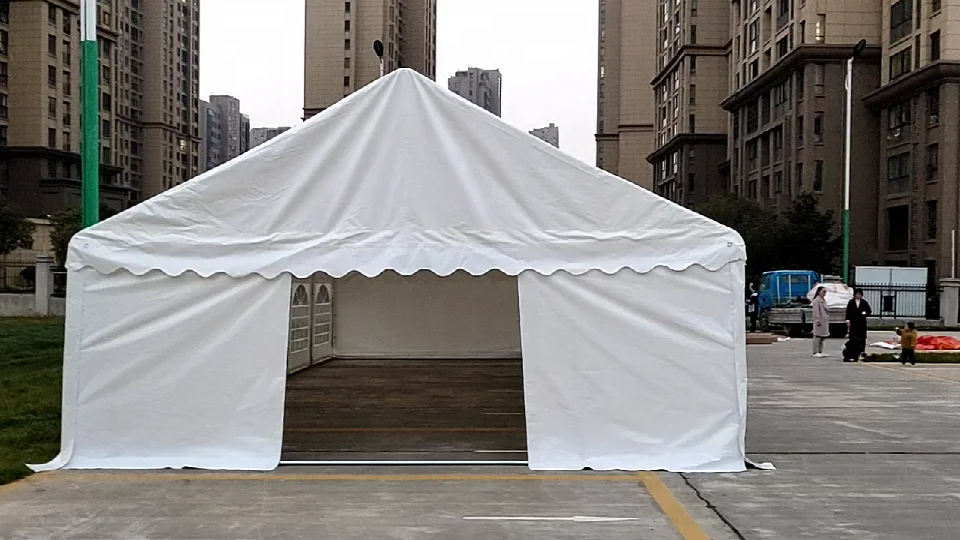 PVC foldable 6x12m event tent with black frame, customizable canopy, suitable for parties and outdoor gatherings.