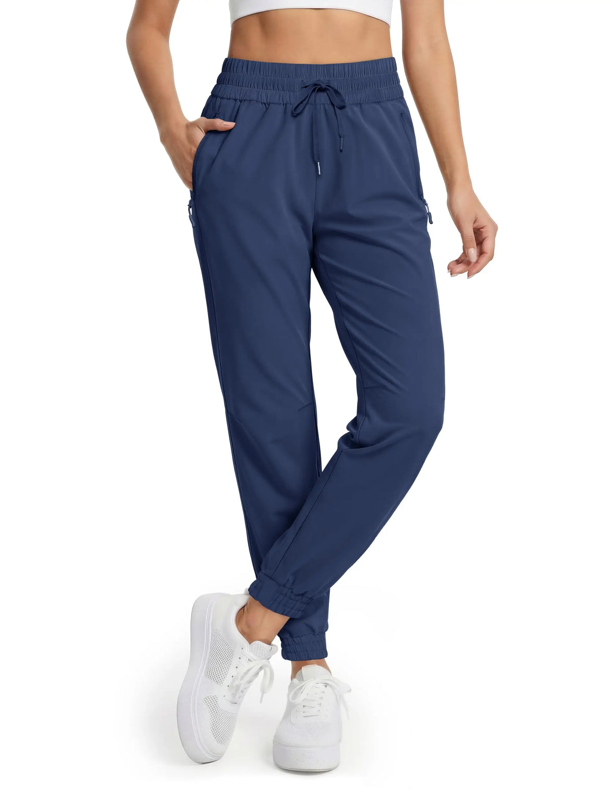 Magcomsen waterproof hiking pants for women in red, designed for outdoor activities, with durable, quick-drying fabric.