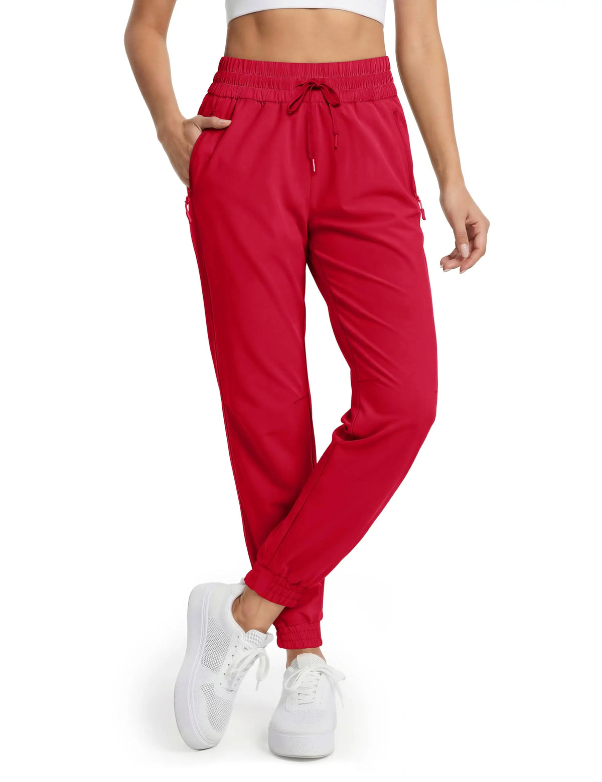 Magcomsen waterproof hiking pants for women in vibrant tomato red, designed for outdoor activities and hiking adventures.