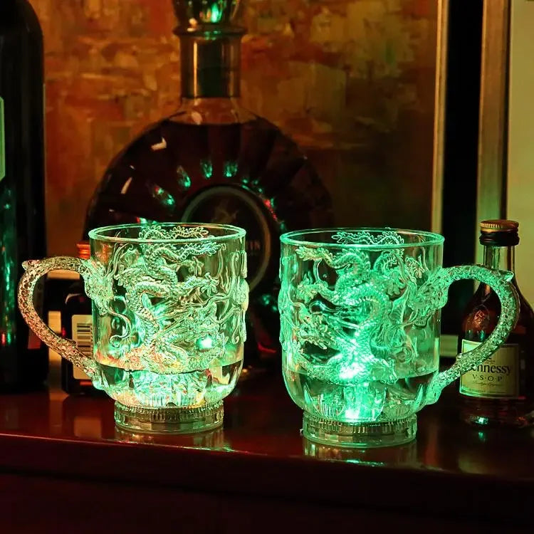 Transparent LED dragon mug by Corporación Turística that changes color with water, featuring integrated lighting for parties.