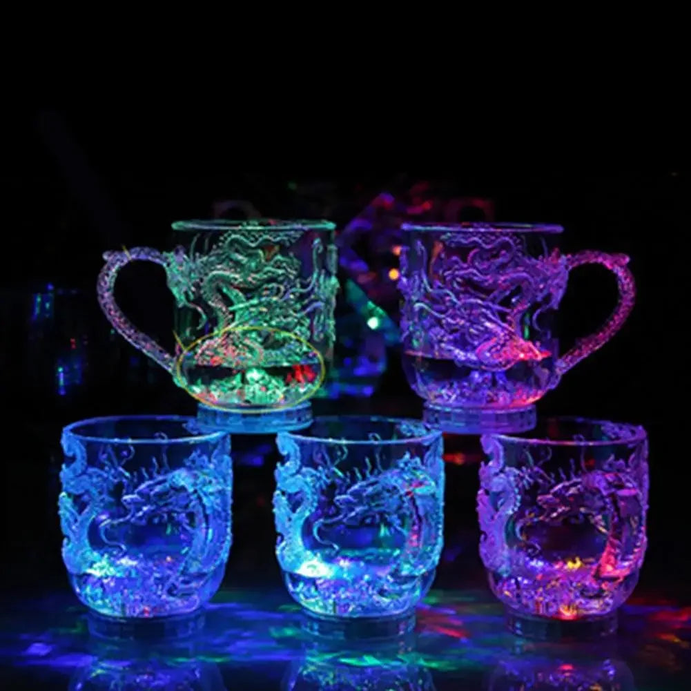Transparent LED dragon mug by Corporación Turística, changes color with water, illuminated for parties and festive events.