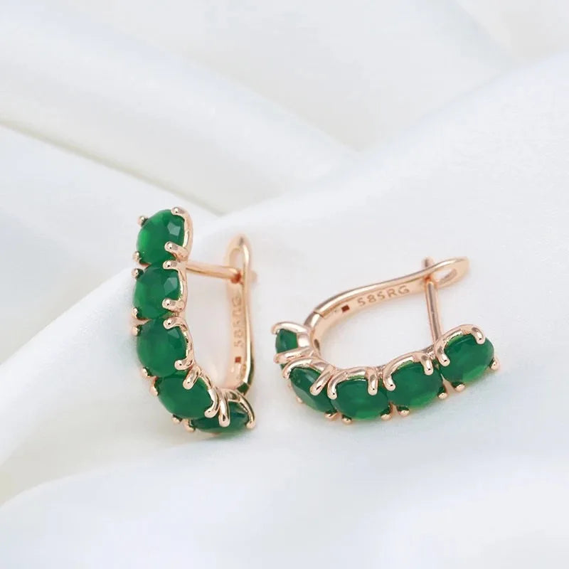 14K gold multi-band ring for women with emerald gemstones, featuring natural green gemstones and intricate design.