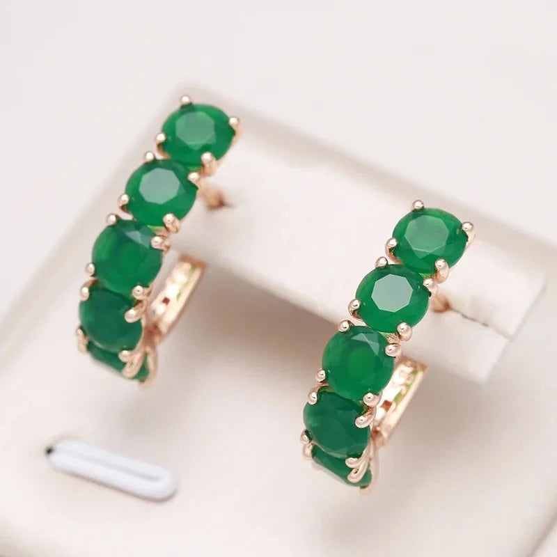 Multiple 14K gold ring for women with emeralds, featuring natural green gemstones, from Corporación Turística.