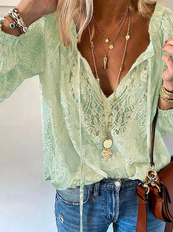 Light green long-sleeve V-neck T-shirt with cut-out design from Corporación Turística, casual style, shown on a model.