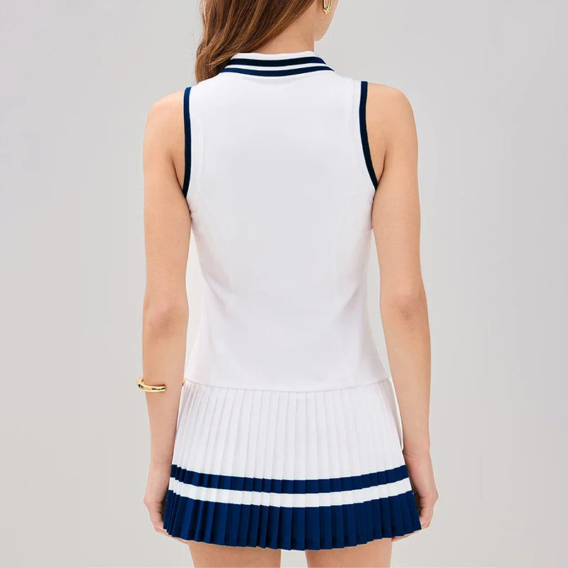 Green women's tennis dress with V-neck and zipper from Corporación Turística, featuring a fitted athletic design.