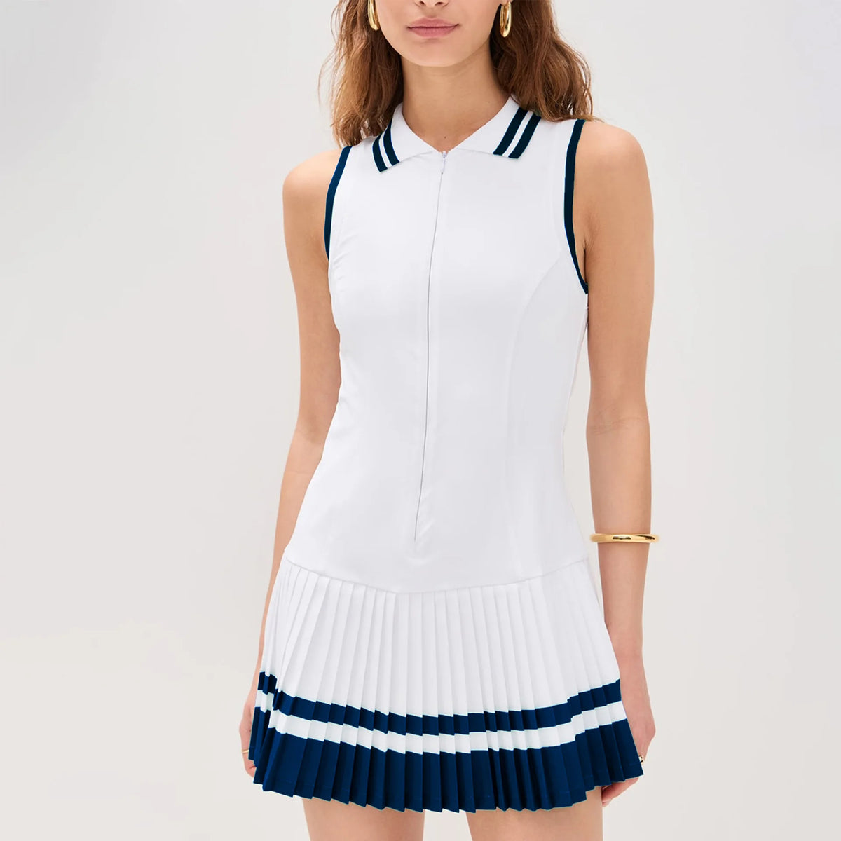Green women's tennis dress by Corporación Turística with V-neck, zipper front, and sporty fit, ideal for active wear.