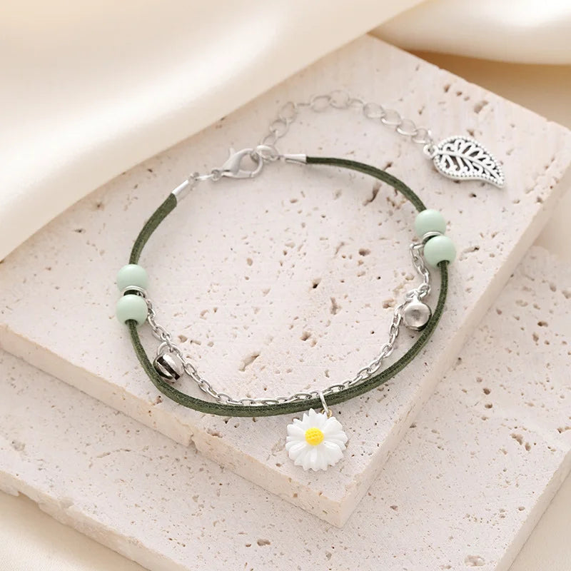 Electronic bracelet watch with round pointer, green band, by Corporación Turística, featuring a sleek quartz design.