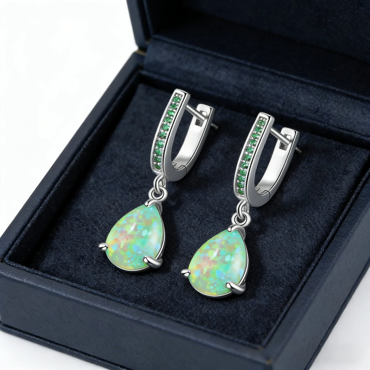 Green fire opal pendant earrings for women, featuring dangling design and vibrant gemstone from Corporación Turística.