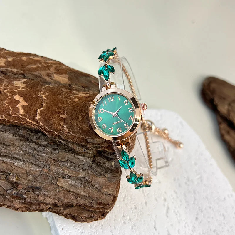 Elegant women's quartz watch with a round case from Corporación Turística, featuring a stylish green dial and sleek design.