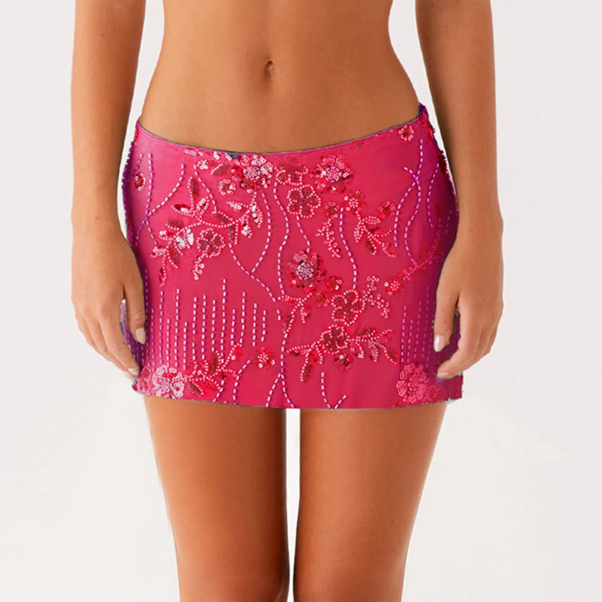 Green women's sequin mini skirt with a flared design, featuring a stylish and shiny appearance for fashionable outfits.