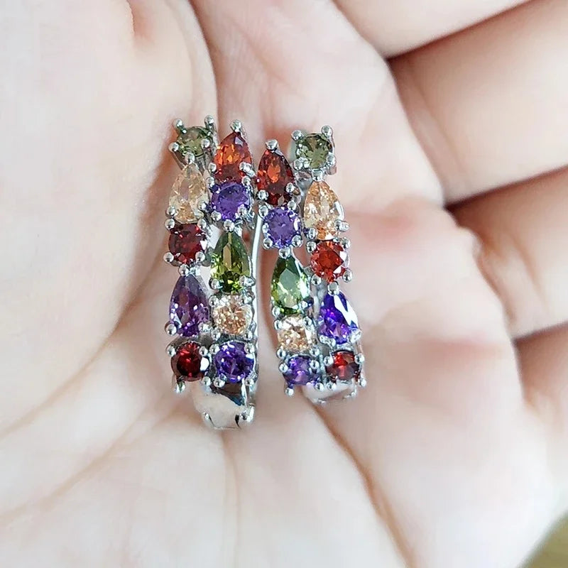 Sterling silver 925 earrings wholesale from Corporación Turística featuring elegant green gemstone accents.