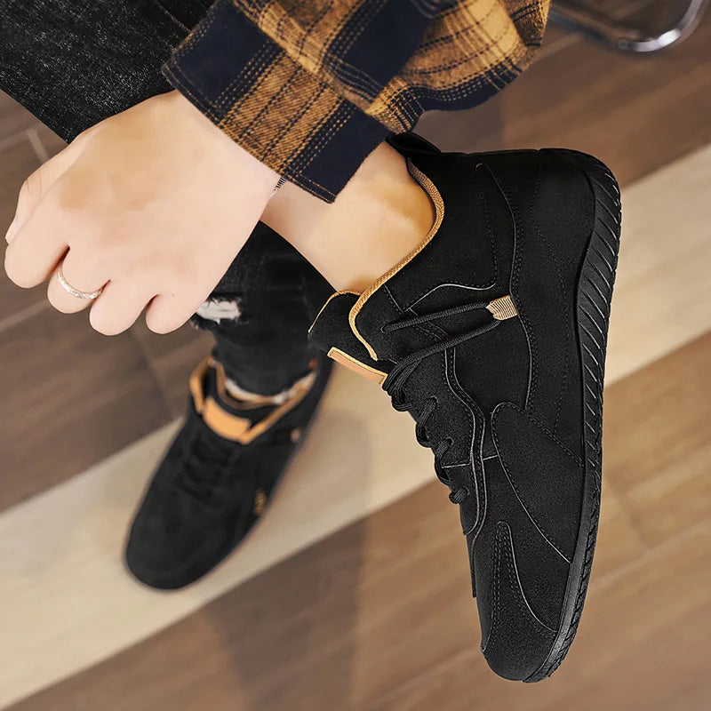 Black men's high-top moccasins and casual sports shoes from Corporación Turística, designed for comfortable everyday wear.