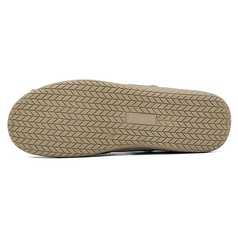 Black high-top casual men's moccasins and sports shoes by Corporación Turística, shown in a close-up image.