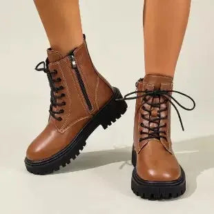 White high-quality women's leather ankle boots with a sleek design, perfect for stylish everyday wear.