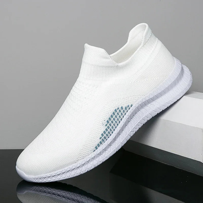 White men's lightweight walking shoes from Corporación Turística, featuring breathable design and comfortable fit for everyday wear.
