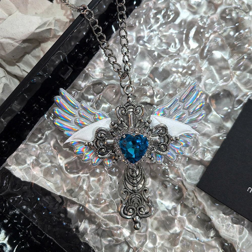 White Y2K-style collar with heart and angel wing pendant, featuring intricate silver detailing and a trendy fashion look.