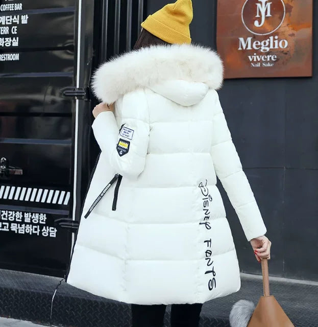 White women's winter parka coat with fur collar by Corporación Turística, featuring a warm, stylish design for cold weather.
