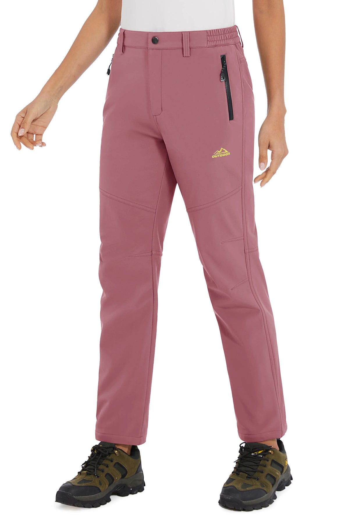 White women's waterproof winter pants by Tacvasen, durable outerwear for cold weather outdoor activities.