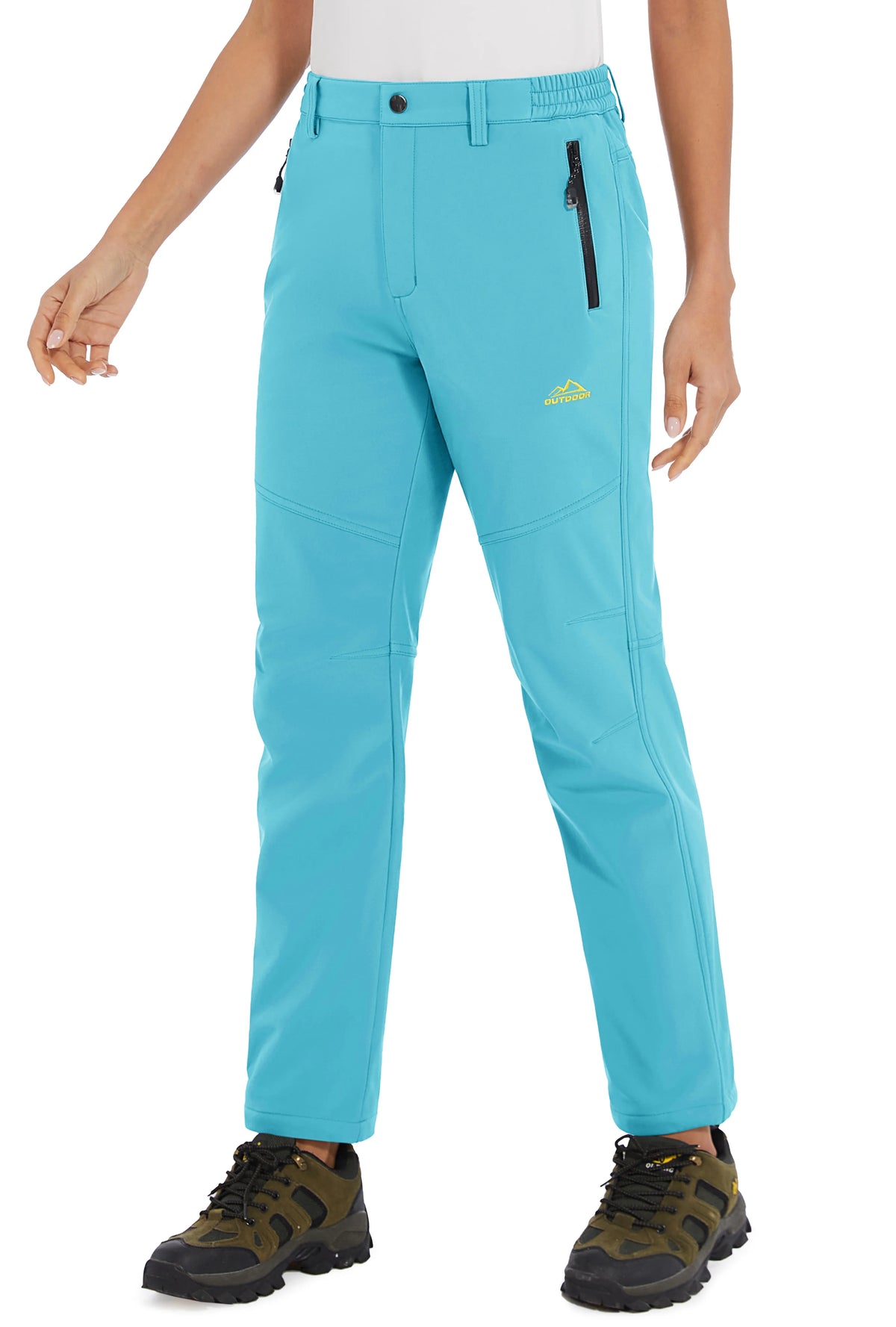 White women's winter waterproof pants by TACVASEN, showing the durable, insulated fabric and adjustable waistband for cold weather.
