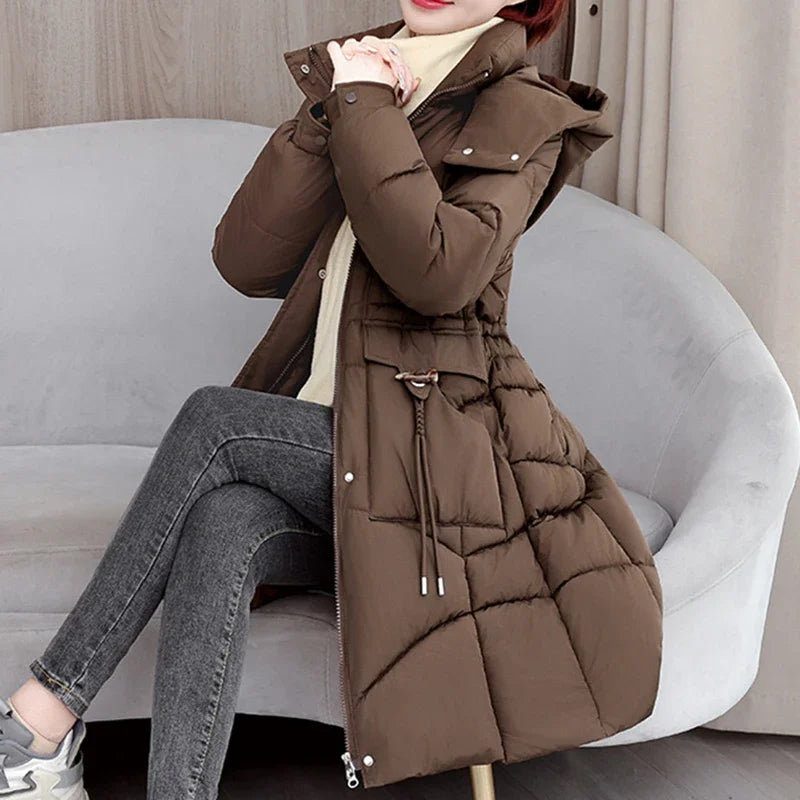 Medium-length hooded women's parka coat by Corporación Turística, white insulated winter jacket with a cozy hood.