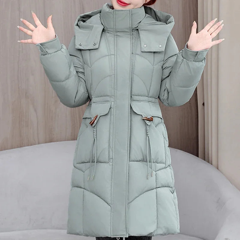 White women's hooded parka coat by Corporación Turística, medium-length winter outerwear with a cozy hood.