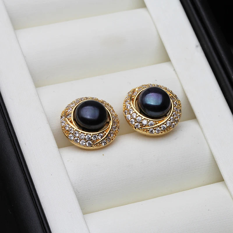 Elegant white freshwater pearl earrings for women by Corporación Turística showing lustrous pearl drops on silver hooks.