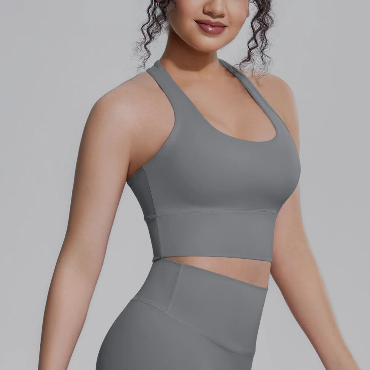 White women's sports top from Corporación Turística, designed for fitness, running, and training activities.