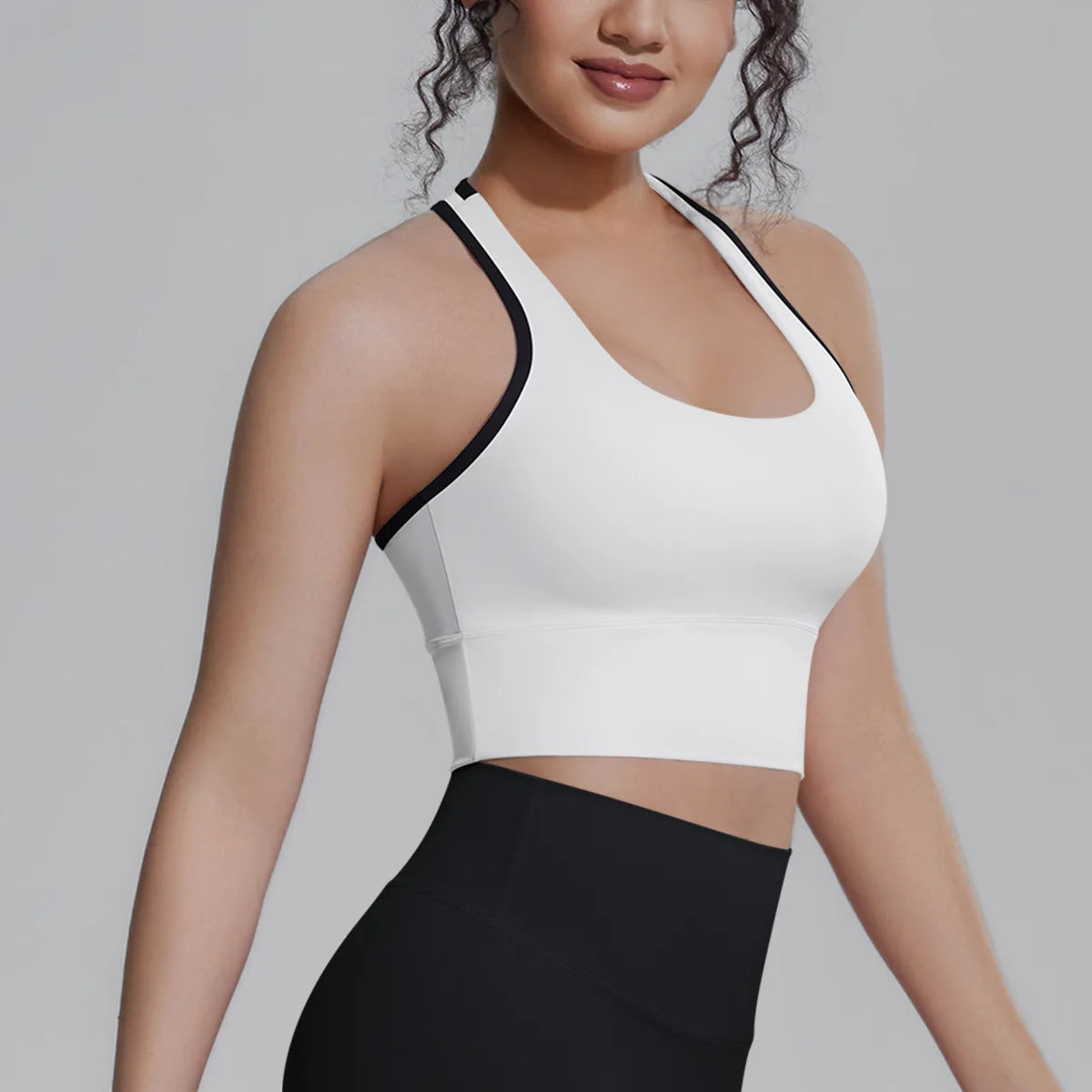 White women's sports top for fitness and running by Corporación Turística, featuring a comfortable, breathable design for active wear.