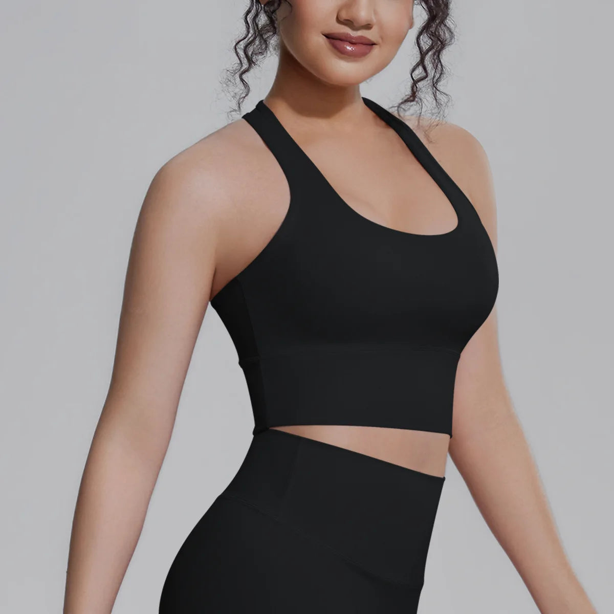 White women's sports top from Corporación Turística, ideal for fitness and running workouts, lightweight and comfortable for active wear.
